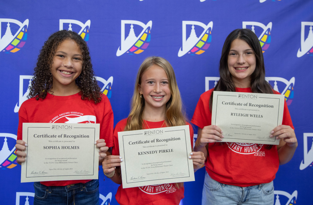 Girls smiling with certificate